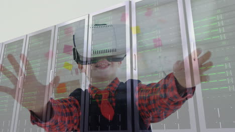 niño usando auriculares de realidad virtual sobre servidores de datos en un entorno tecnológico