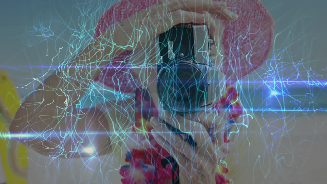 Person in pink hat taking photo with electric light animation overlay