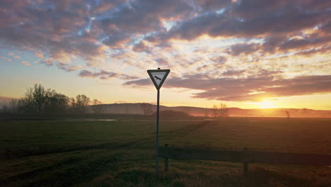 mid shot of a german nature reserve sign in a beautiful grassland area during a golden sunrise