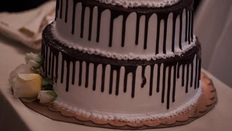 three-tiered chocolate drip wedding cake