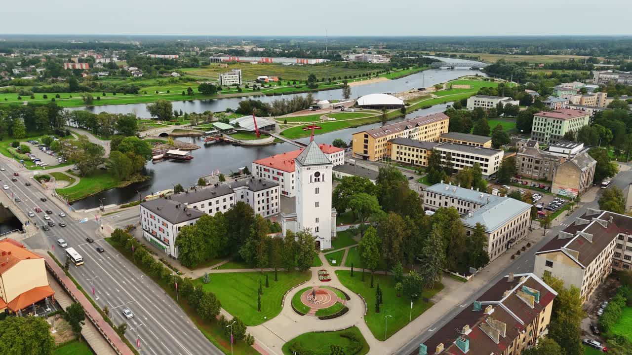 Drone view of Jelgava cityscape with clock tower, park and river