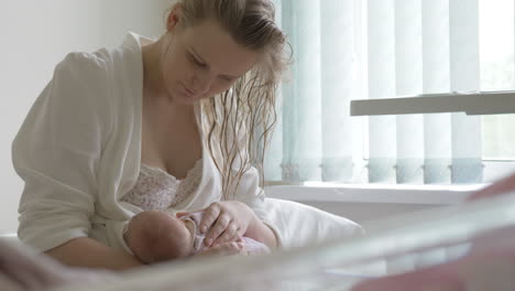 newborn baby being breastfed