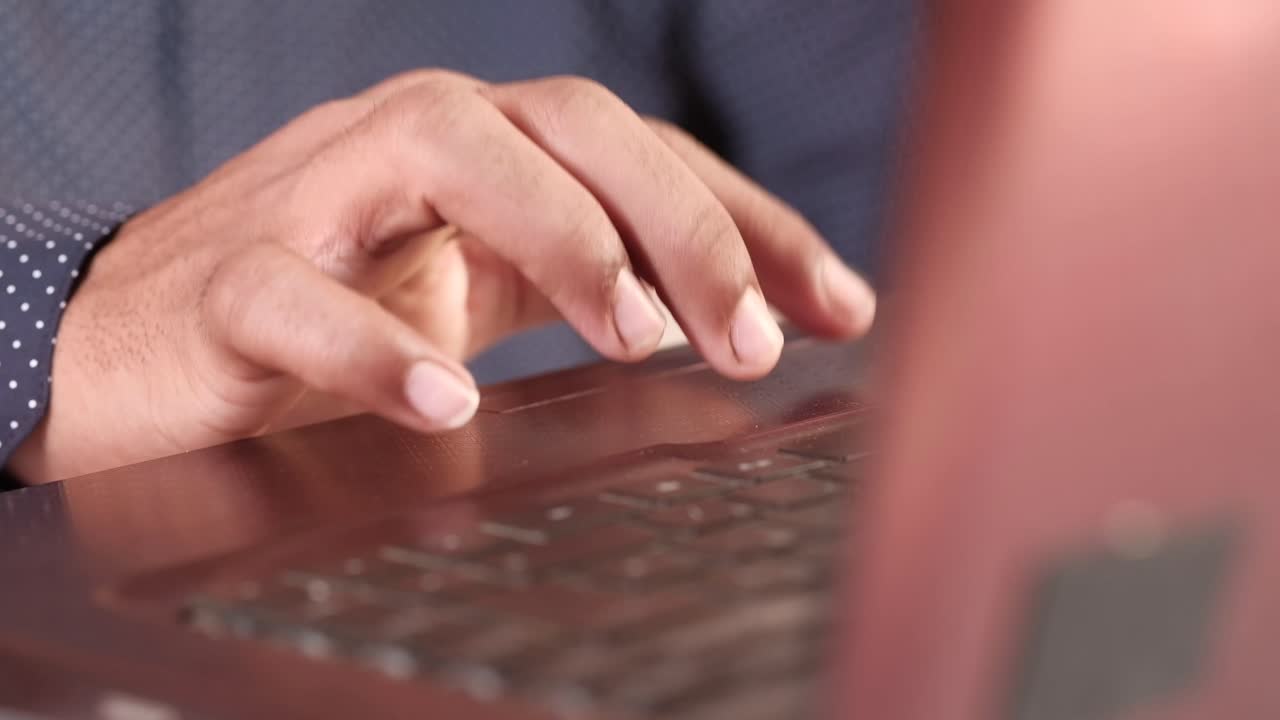 Person Typing on Laptop
