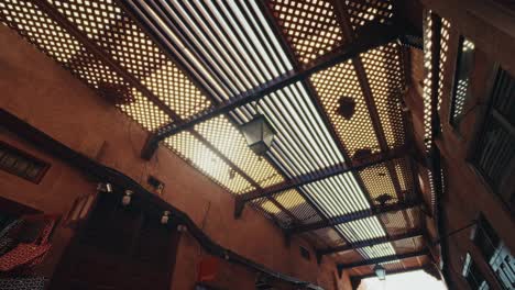 walking through the souks markets in the medina old town in marrakesh, morocco