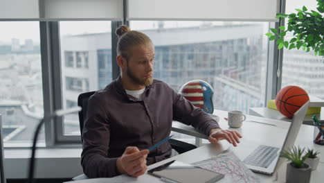 Successful-guy-video-chatting-online-workplace-closeup.-Man-analyzing-project