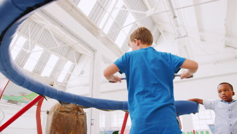 Kids-in-centrifugal-experiment-at-science-centre,-low-angle