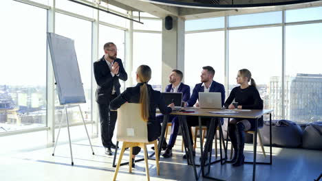 colleagues employees working in office. business partners cooperating together at a table. team of business people meeting in modern office room.
