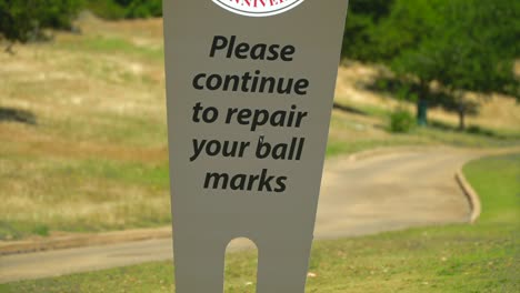 close up of good golf etiquette sign