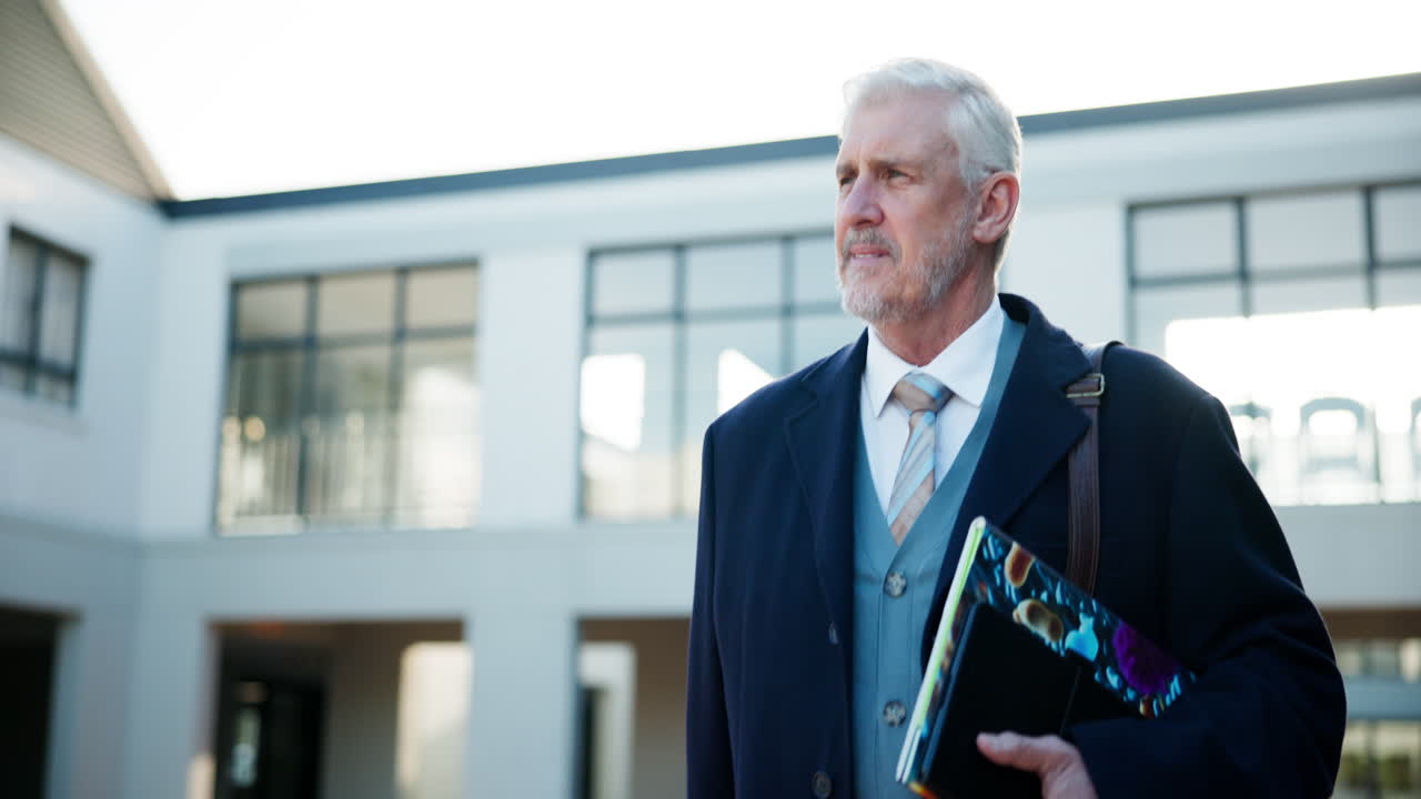 Mature businessman outside office building