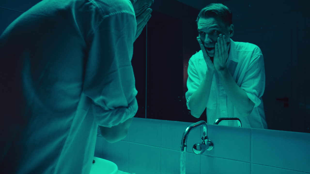 Man in Bathroom Mirror