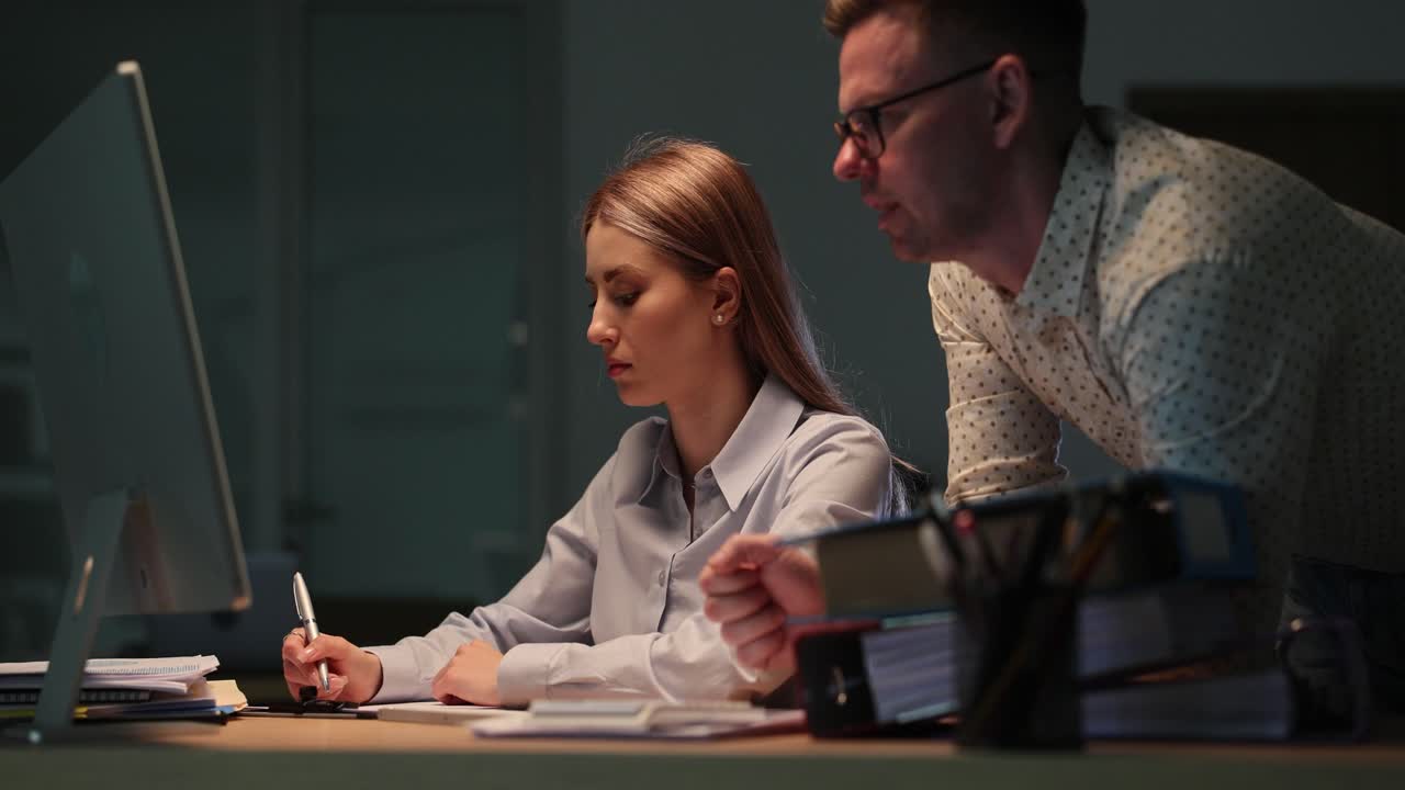 Teamwork in the Office at Night