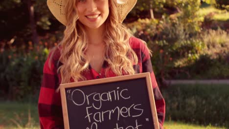 Pretty-blonde-selling-organic-vegetables-at-market