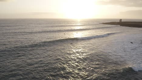 Blissful-sunrise-on-south-coast-of-Iceland-with-perfect-swell-at-shore