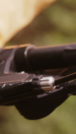 close-up of mountain biker pressing brake