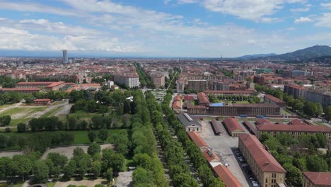 aerial view of turin city center drone revealing skyline while fly above park and old architecture building