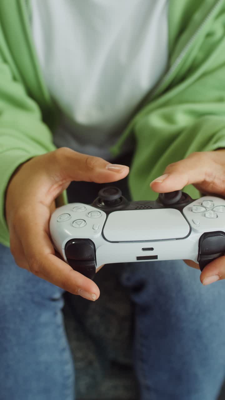 Person Holding a PlayStation 5 Controller