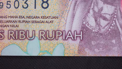 macro shot of the indonesian rupiah, focusing on details of bill