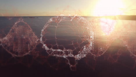 animación de un cerebro digital girando sobre el mar y el cielo al atardecer