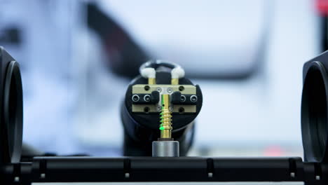 robotic arm performing precision assembly of a small component