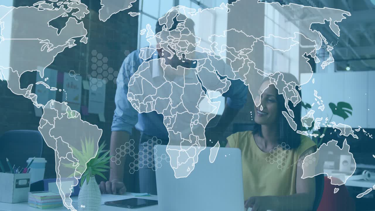 Team leaning, pointing at laptop, starting world map expanding with hex nodes, discussing business