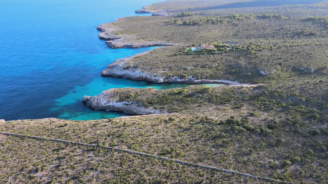 Discover the breathtaking Cala Varques area near Porto Cristo in Majorca. The serene landscape features rocky cliffs, soft waves, and vibrant blue waters, perfect for relaxation and nature lovers.