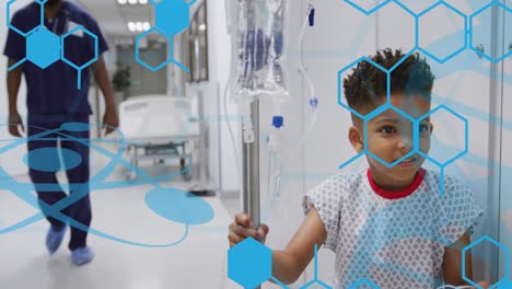 animation of medical data processing over biracial boy patient in hospital