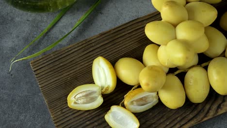 the date-palm fresh they are placed on the table with oil, health food concept.,  date palm. raw date palm(phoenix dactylifera) fruits