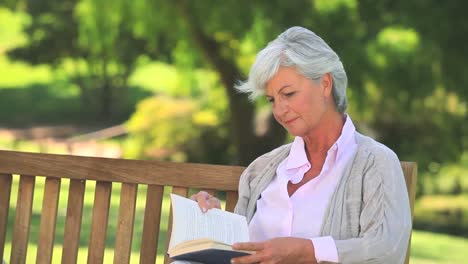 Mature-woman-reading-a-book