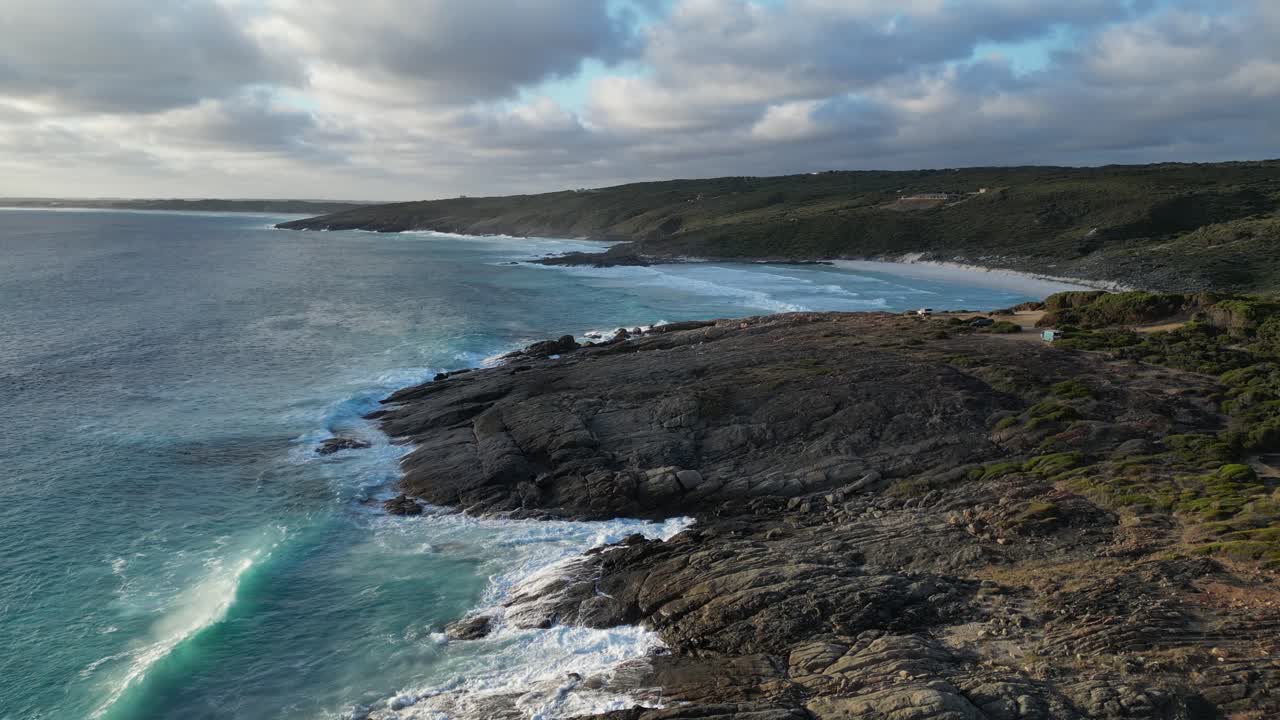 Drone Flying Low Over Rocky Bremer Bay In Open Blue Ocean, Waves Crashing Into Rocks, Australia