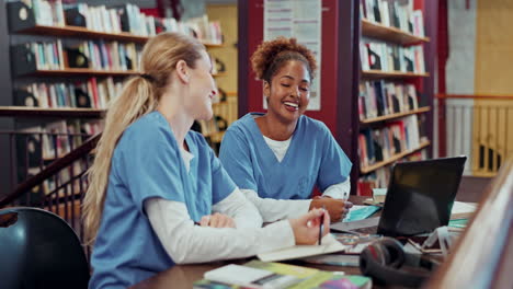 nursing students studying together in the library