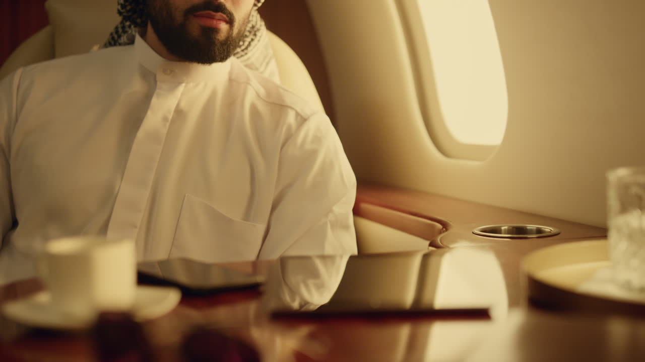 Successful arabian looking camera on luxury flight portrait. Oil company owner