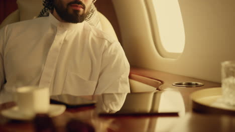 successful arabian looking camera on luxury flight portrait. oil company owner