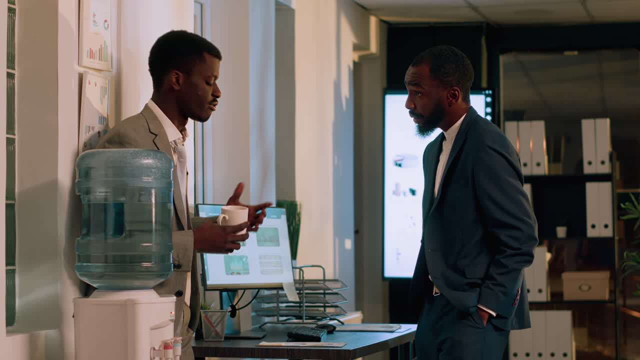 Businessmen discussing work in office