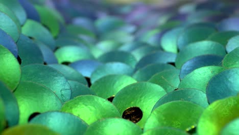 macro view of a valley of blue, teal, and green sequins