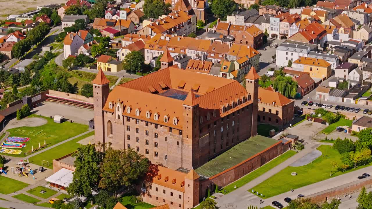 Cinematic aerial shot of Gniew Castle landmark fortress and Polish heritage site