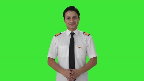 Happy-Indian-male-pilot-smiling-Green-screen