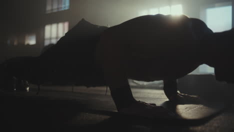 man doing push-ups in a gym