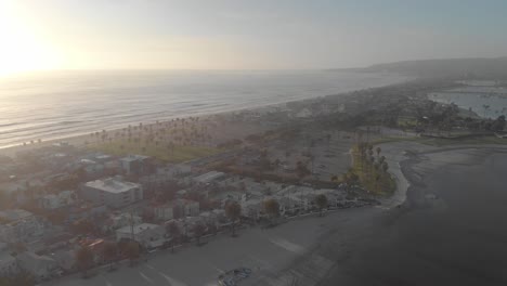 aerial view of a coastal city with beach and bay