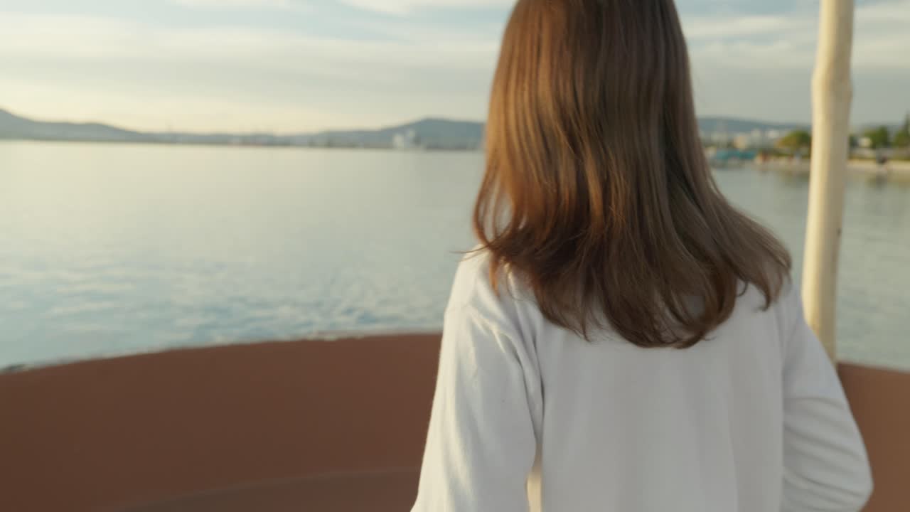 Reveal shot of a girl walking during golden hour