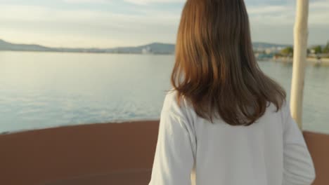 Reveal-shot-of-a-girl-walking-during-golden-hour