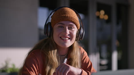 portrait of a smiling woman with headphones