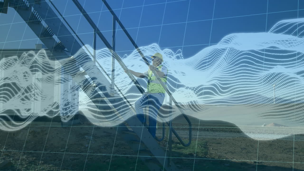 Man wearing hard hat, safety vest climbing metal staircase at site showing digital grid, waveforms