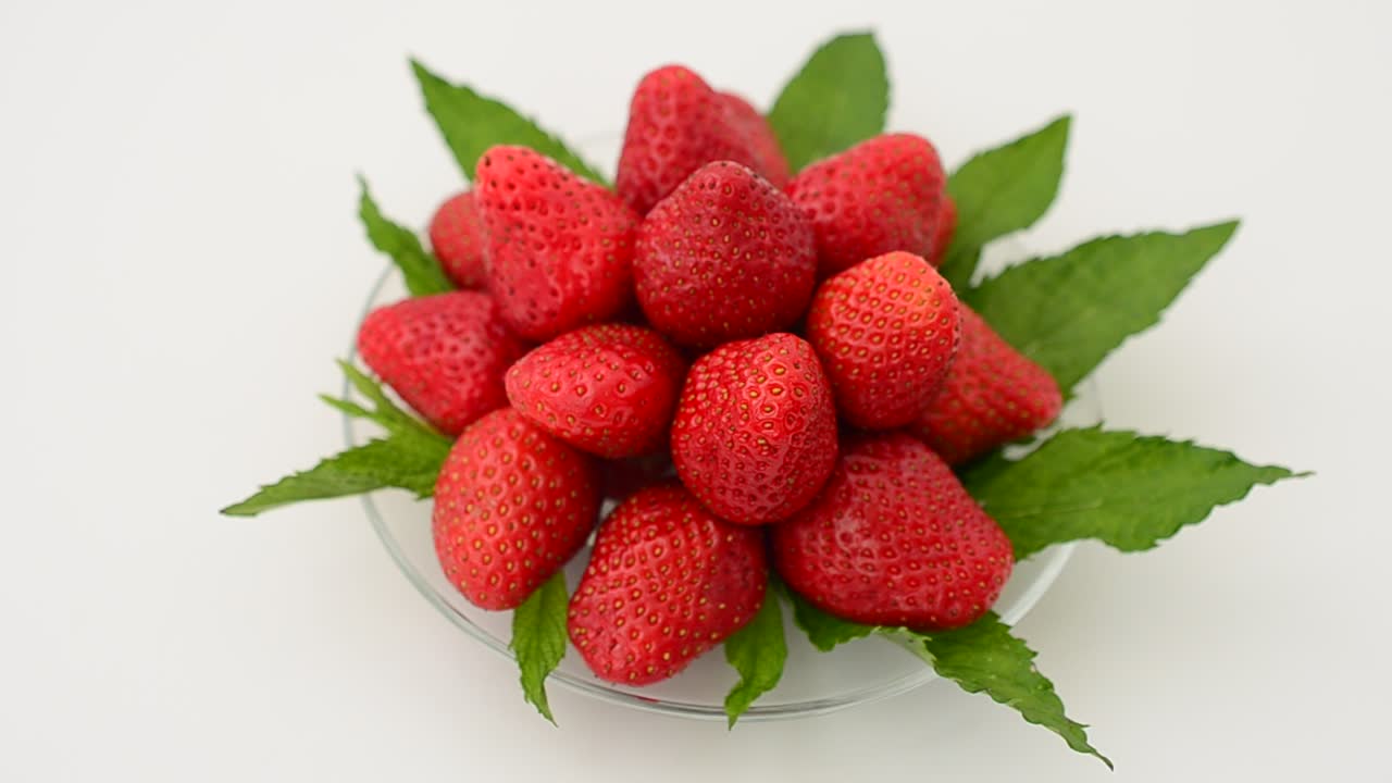 Strawberry on a white background, isolate. Shooting in the movement