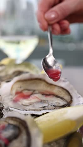 preparing oysters with sauce