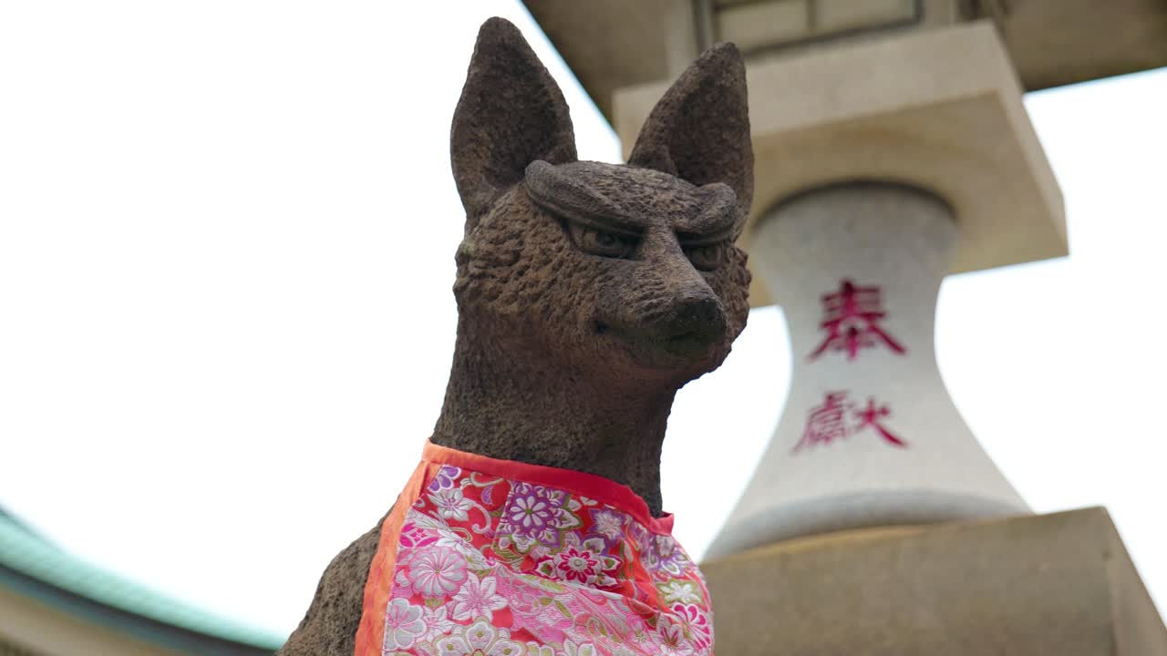 A Statue of a Fox in a Traditional Inari Shrine Japanese Temple in Tokyo, Japan