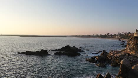 flying over the beautiful laguna beach tide pools at sunset in california