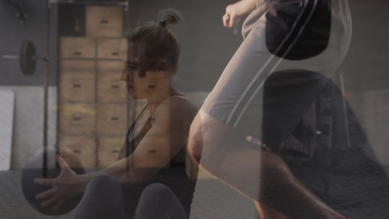 Exercising with medicine ball, two people in gym, creating animation effect