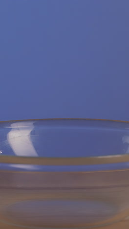 pouring cereal into a bowl