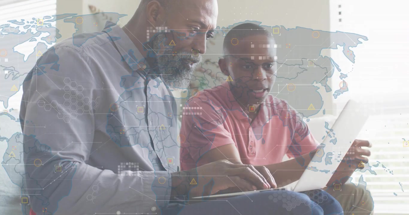Teenager pointing at laptop causing father leaning and typing while reviewing tech map data overlay