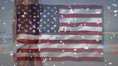 Animation-of-american-flag-and-confetti-over-caucasian-woman-at-beach